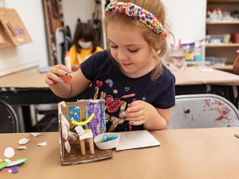 Young girl creates miniature room in classroom (SAC)